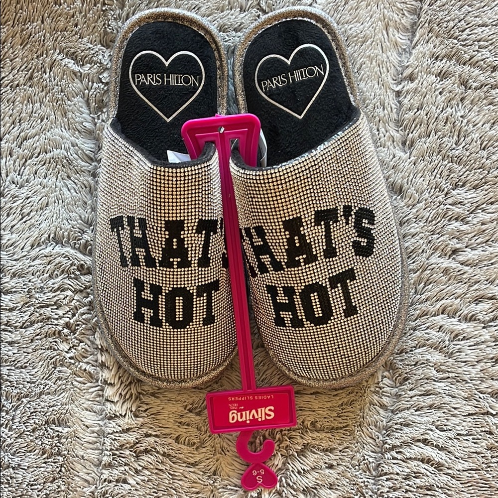 Paris Hilton Silver Slippers with 'That's Hot' Design